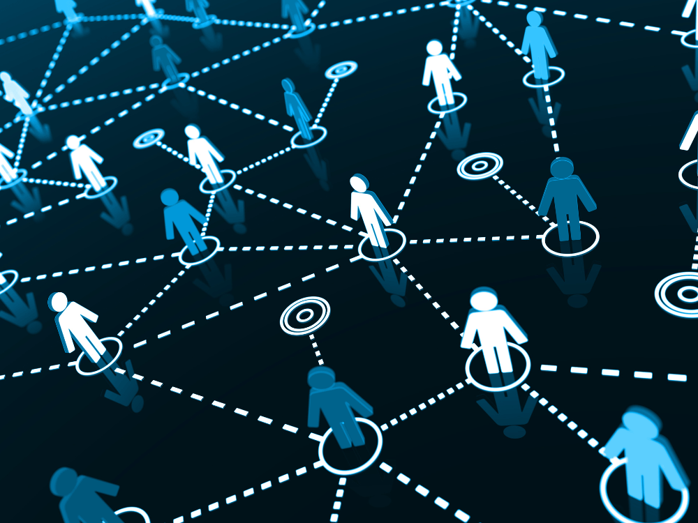 Ícones de usuários conectados por linhas pontilhadas, representando a comunicação entre dispositivos em uma rede digital.